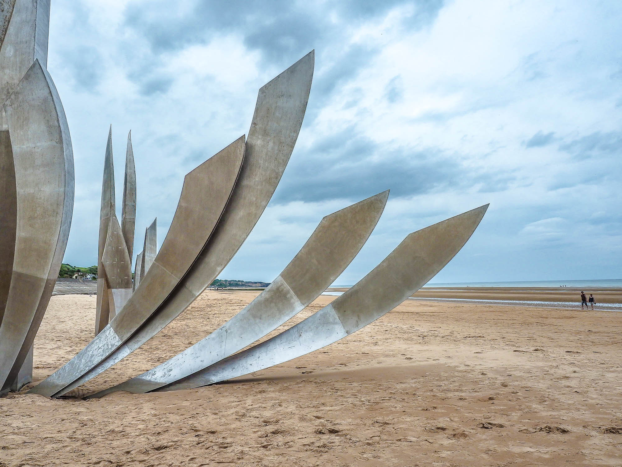 large steel memorial on a big empty beach
