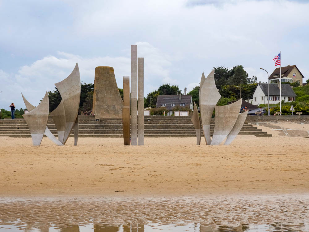 large memorial sticking out of the beach
