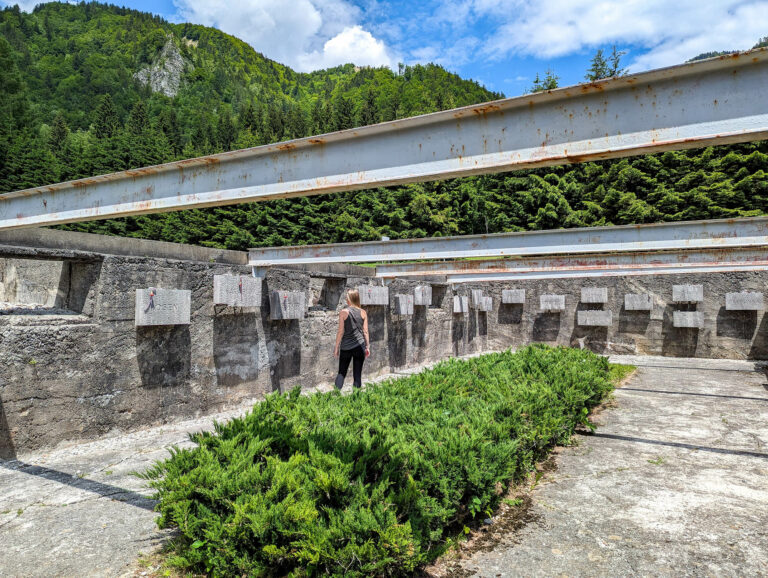 remains of a former camp building filled with memorials