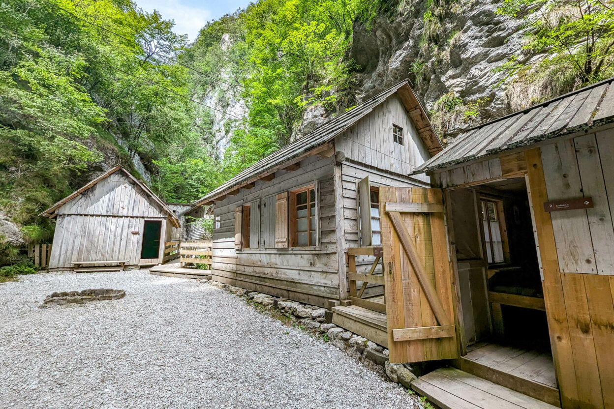 group of wooden buildings built into a rocky gorge
