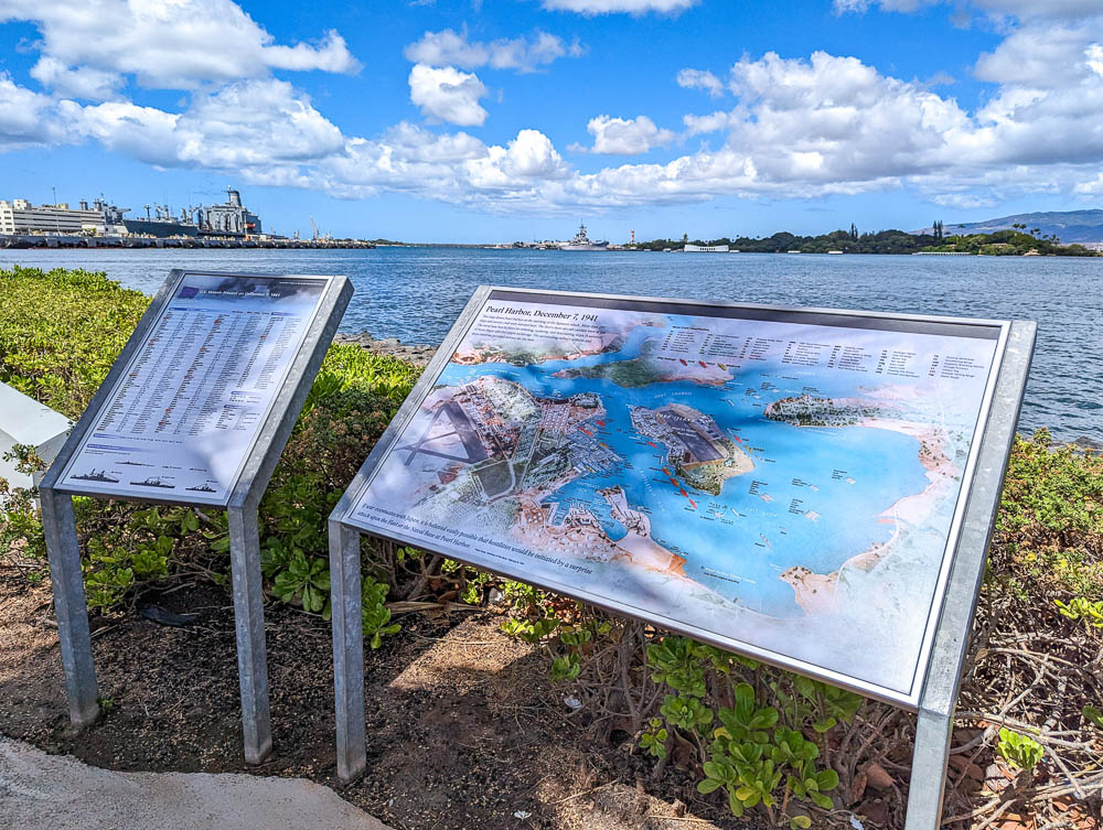 information panels and maps next to the ocean
