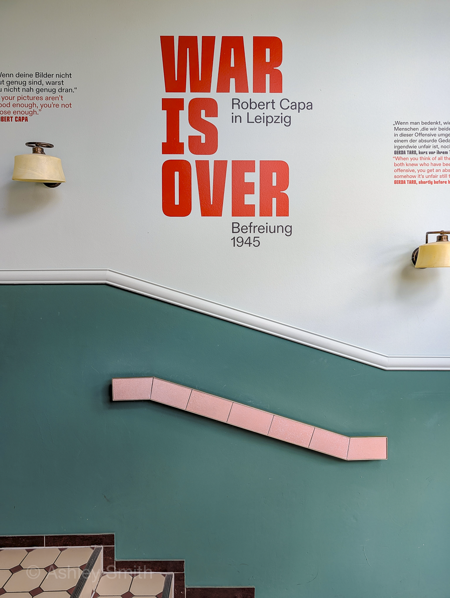 "war is over" sign on a wall
