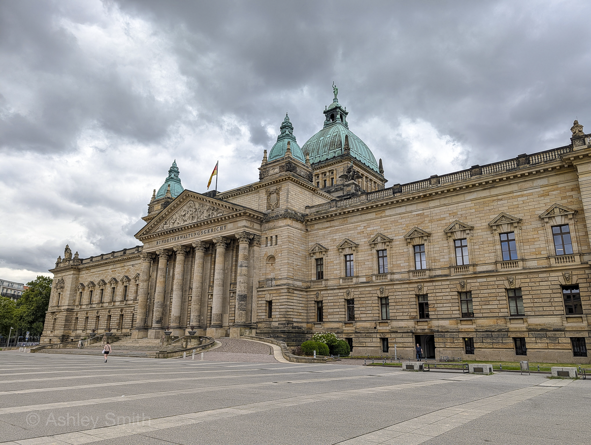 large brown courthouse building with patina dome