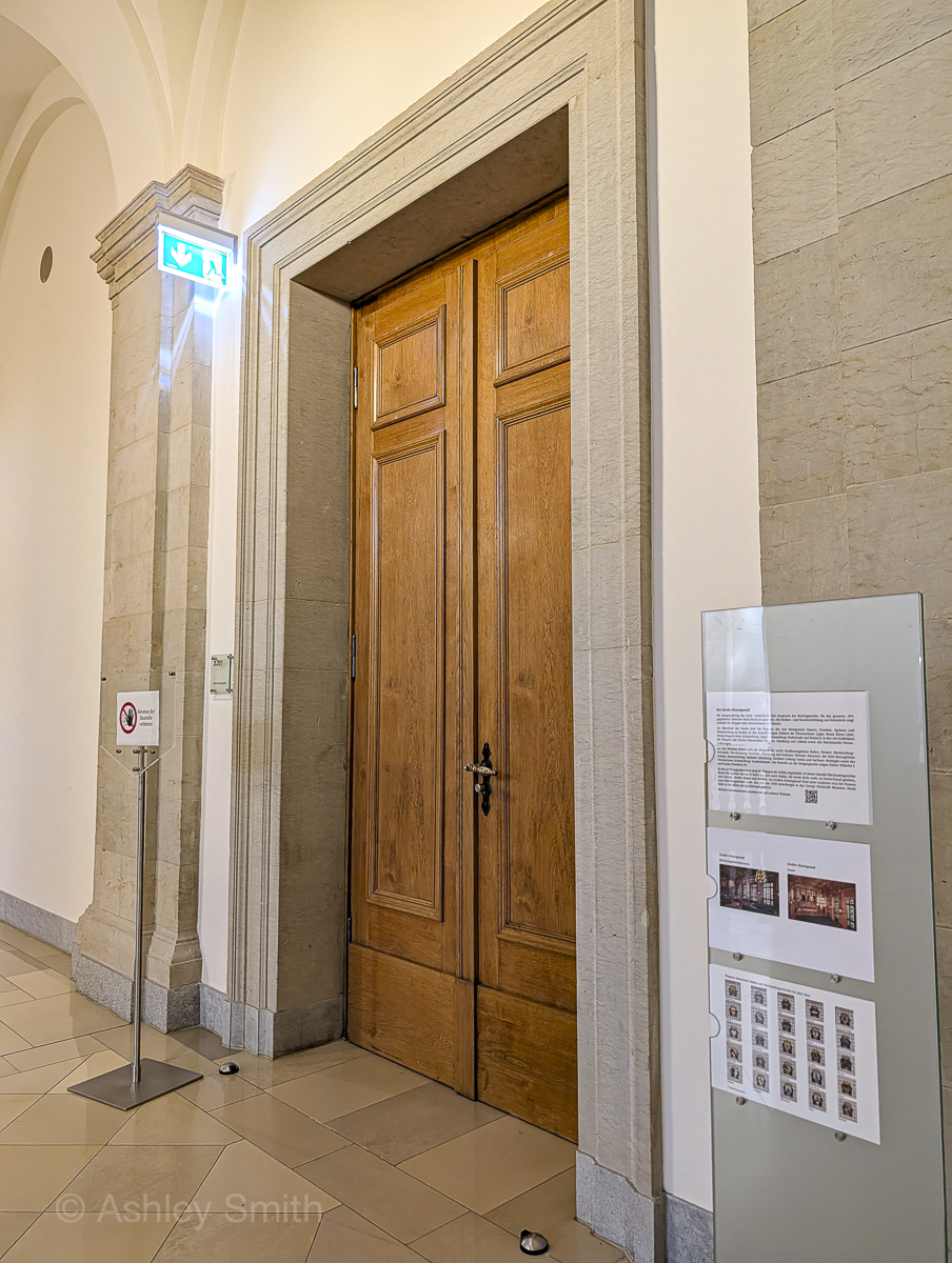 large wooden door inside a courthosue