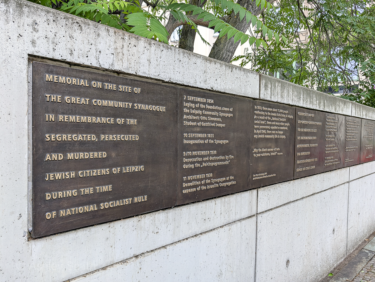 large brown plaque on a stone wall